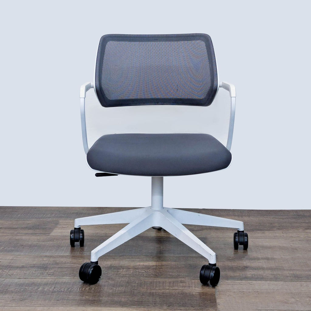 Steelcase chair with mesh back, padded seat, and casters for mobility.