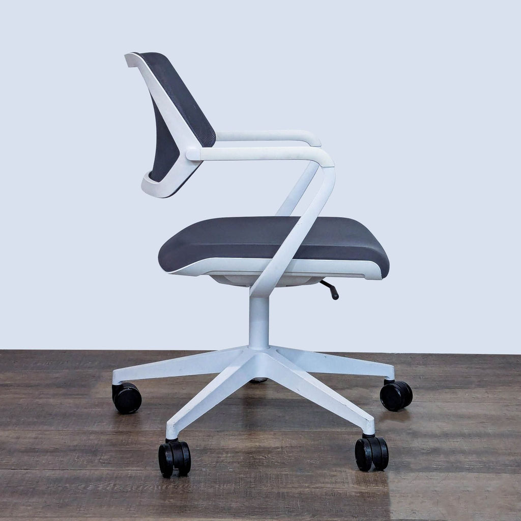 Side view of a Steelcase chair showing ergonomic design with armrests.