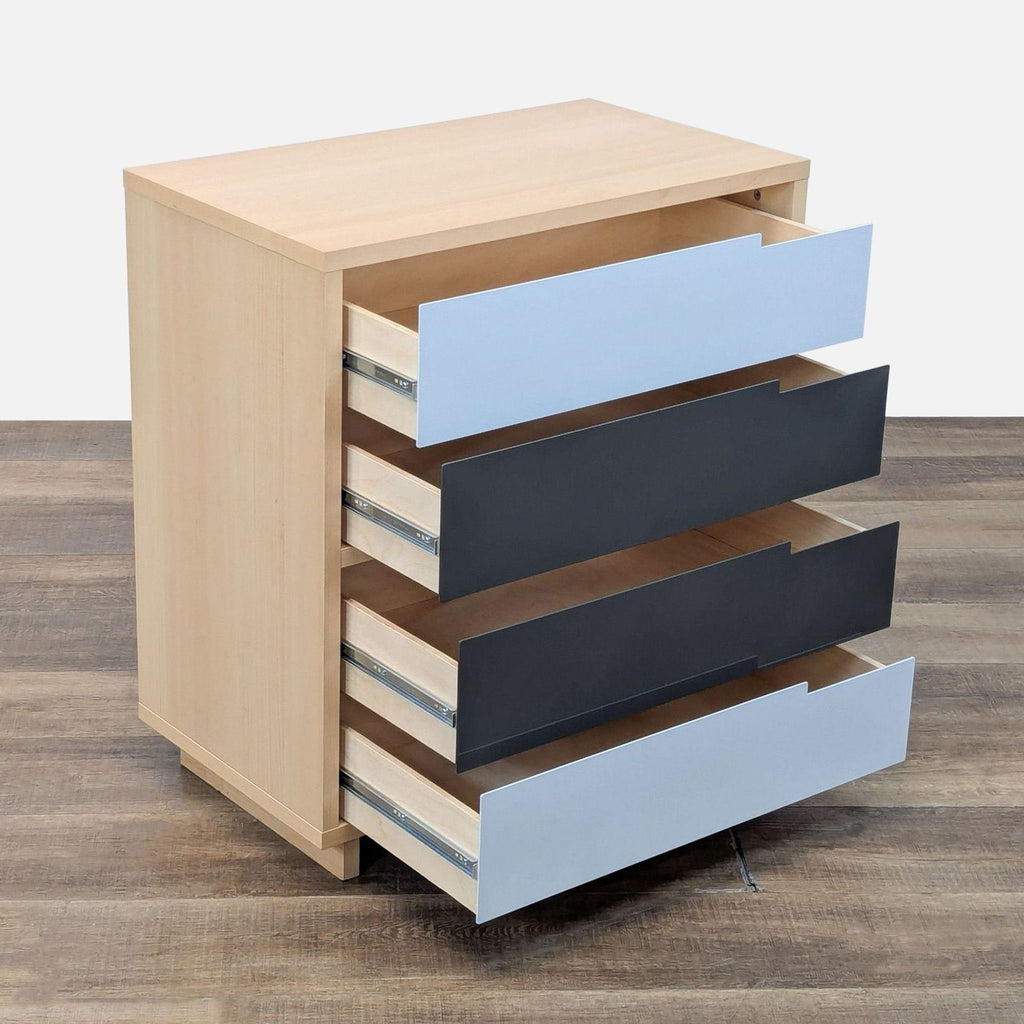 Side view of Blu Dot's maple veneer dresser on wooden floor.