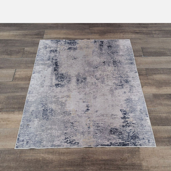 1. Reperch rug with a textured abstract design, non-slip backing, and machine-washable material.