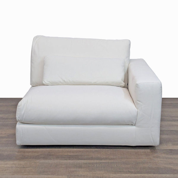 Modular chair with right track arm and thick cushions, featuring a washable slipcover.