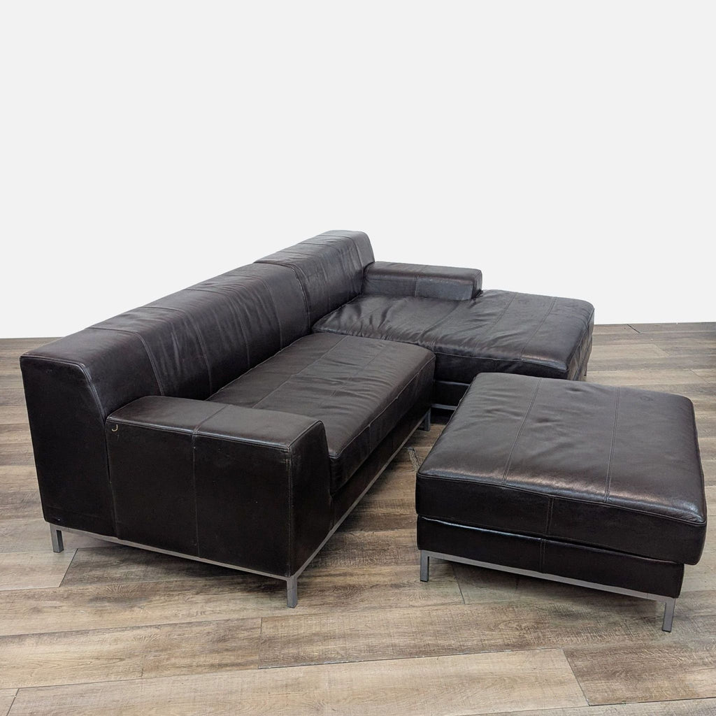 IKEA leather sectional featuring a metal framework, placed on a wooden floor setting.