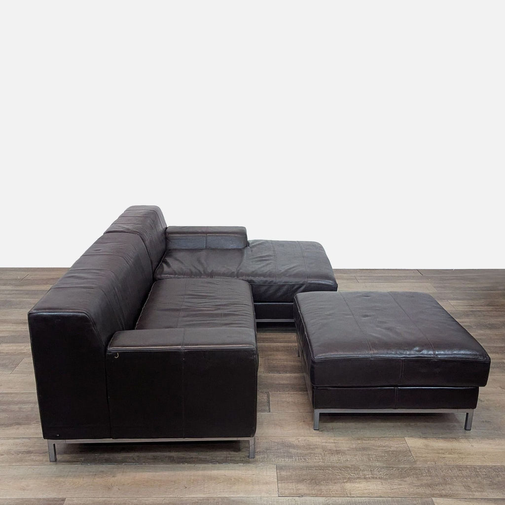 Brown leather sectional from IKEA with metal legs, displayed on a wood-patterned floor.