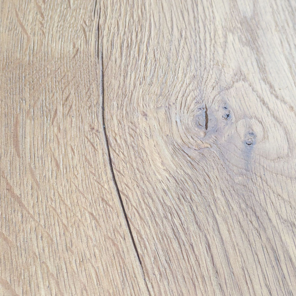 Close-up of wood grain texture showing unique patterns and cracks on the table surface.