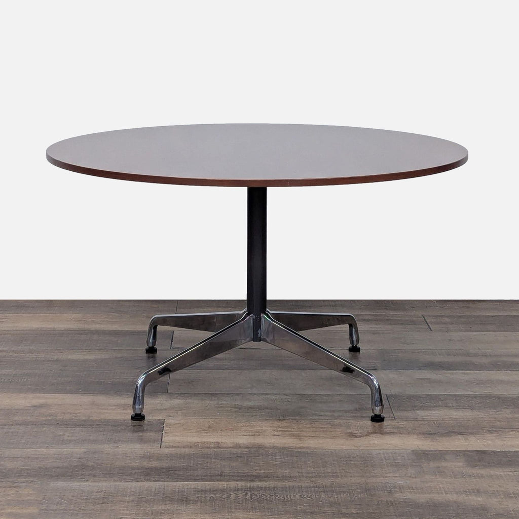 Eames Table by Herman Miller with stainless-steel base and walnut top in cherry finish.