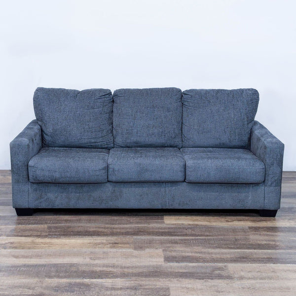 Gray Wanek Furniture sleeper sofa with thick cushions and track arms.