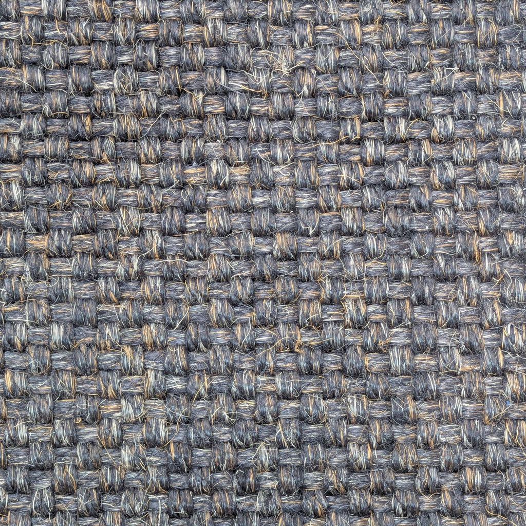 Close-up of a sisal rug's basket weave texture from RH.