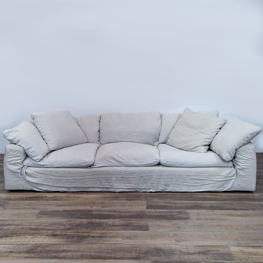 The Cloud® Sofa by Restoration Hardware, a cozy 3-seater with soft cushions and washable slipcovers.