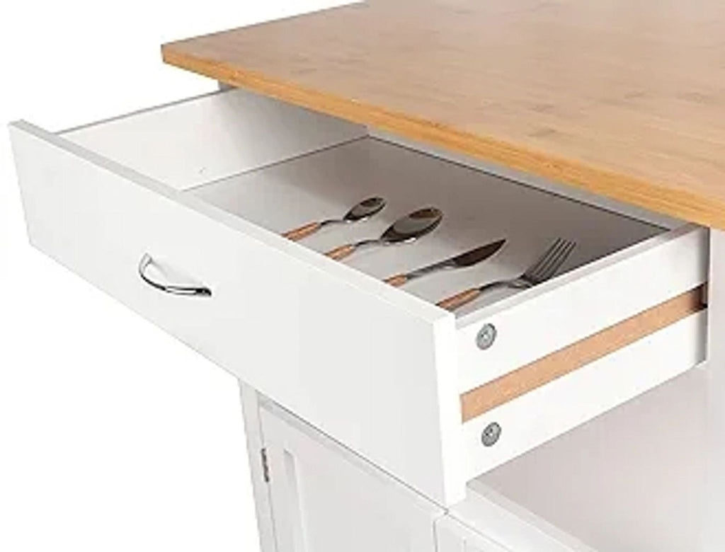 Close-up of open drawer with cutlery under a wooden top.  