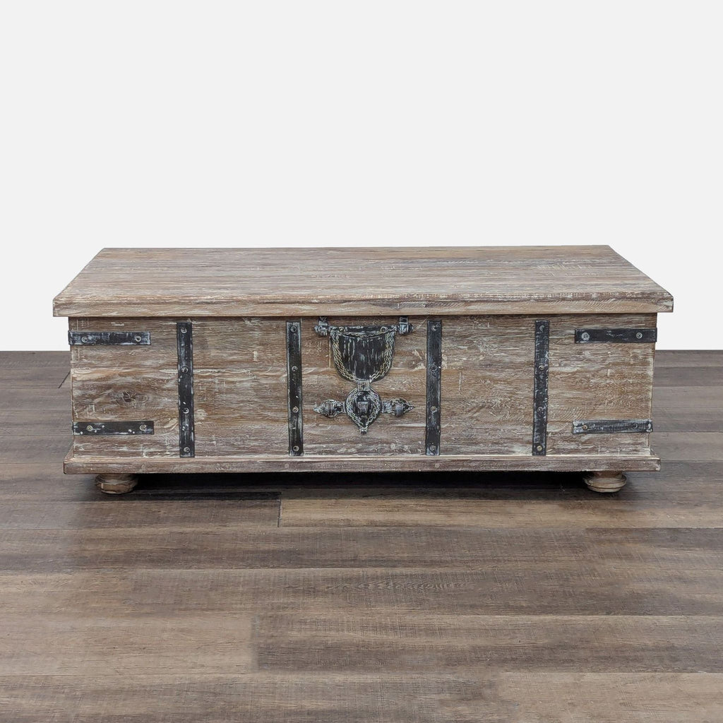 Reclaimed wood lift-top coffee table with wrought iron hardware by Pottery Barn.