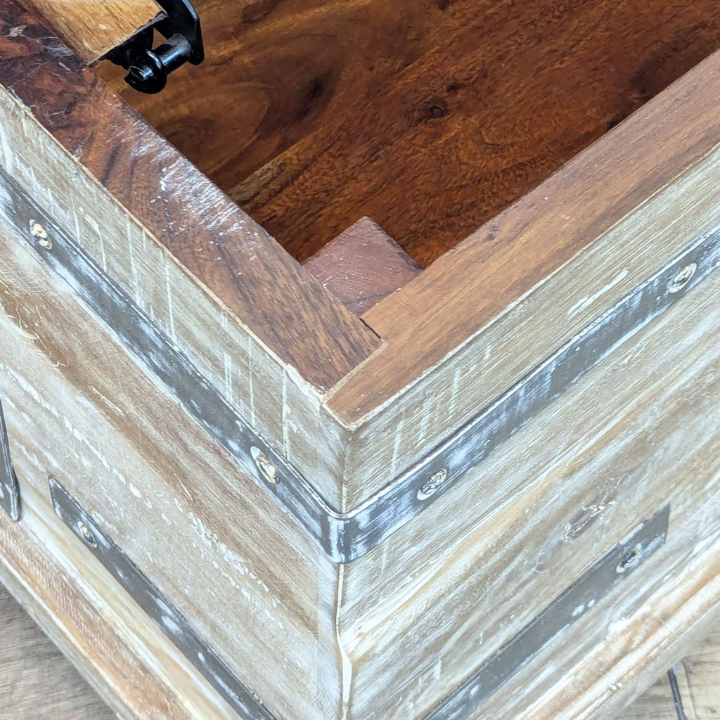 Close-up of Pottery Barn coffee table's reclaimed wood and hand-finished detail.