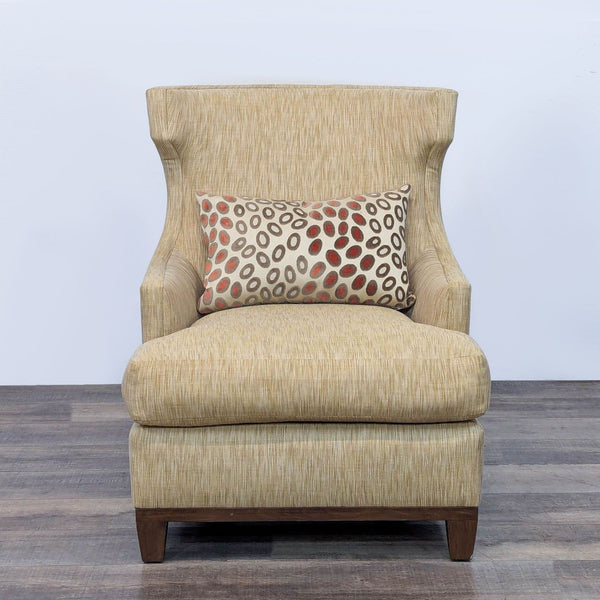 High wingback chair with wood base and neutral upholstery.