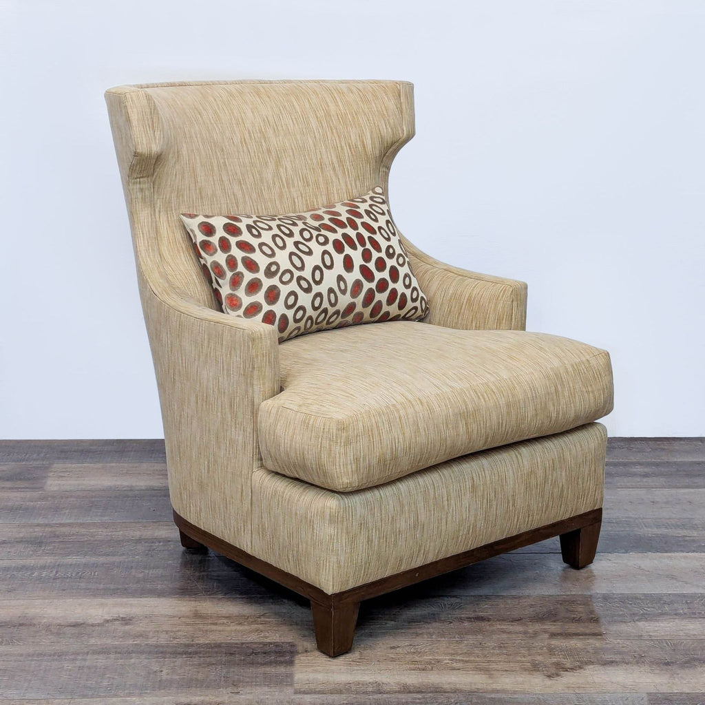 High wingback chair featuring neutral upholstery and decorative cushion.