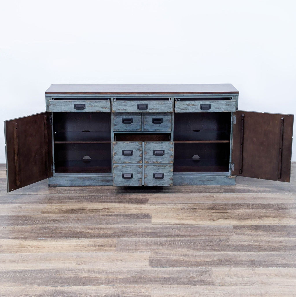 Console with apothecary-style front, functional drawers, and cabinets with shelves for wire management.