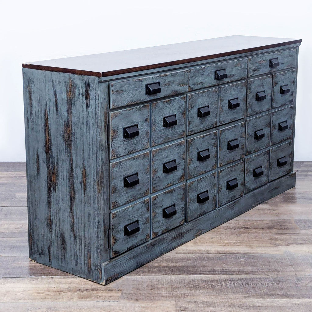 Side view of the console showcasing distressed finish, espresso-stained top, and black metal handles.