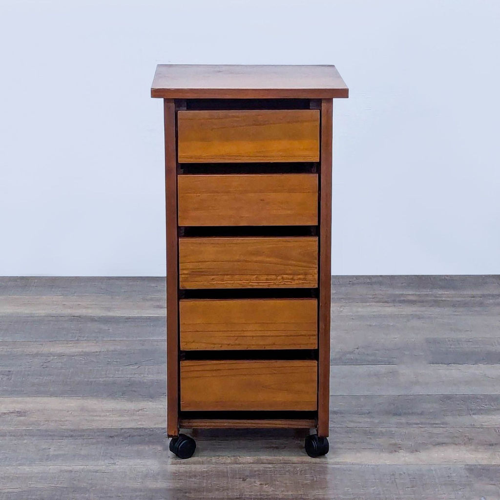 Tall wooden storage cart on casters with slatted sides, featuring multiple drawers.