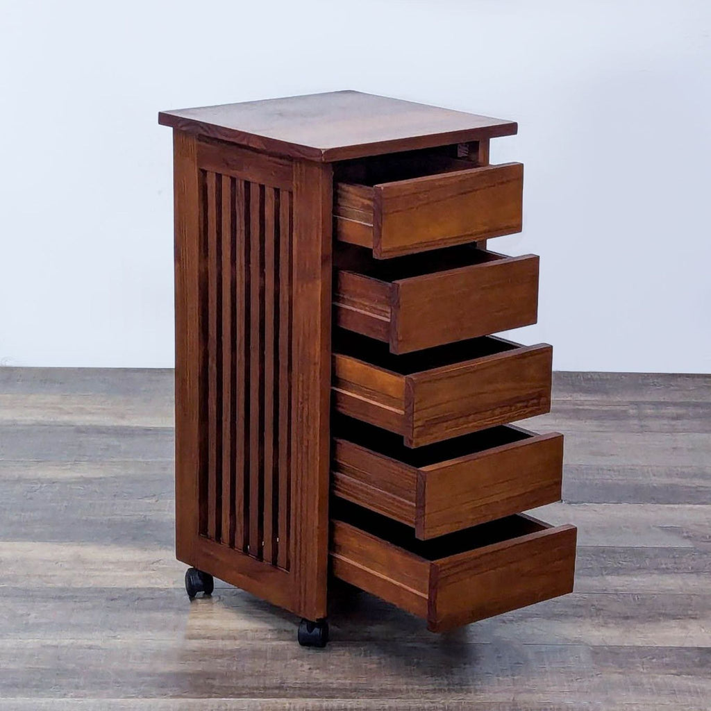 Rustic storage cart with open drawers, showcased on casters and detailed with side slats.