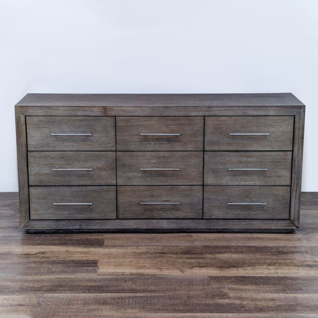 Wade Logan dresser with 9 drawers, weathered gray-brown finish, chrome handles.  