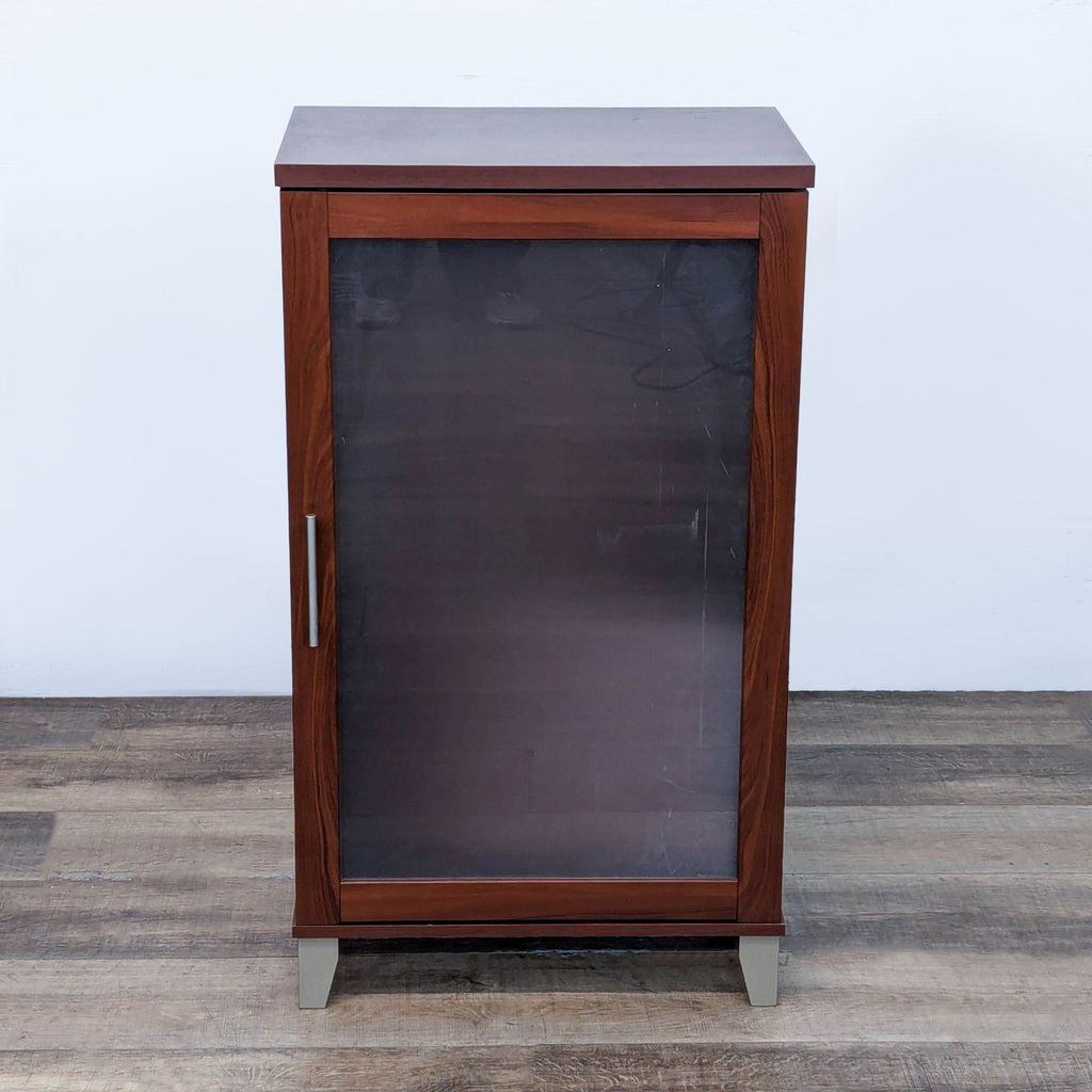 Adjustable shelves and ventilation slots in a cherry-finished Bush Furniture cabinet.