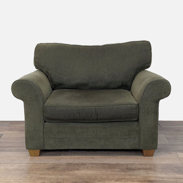 Oversized lounge chair with rolled arms, tapered wood feet, and plush cushions by Bauhaus.