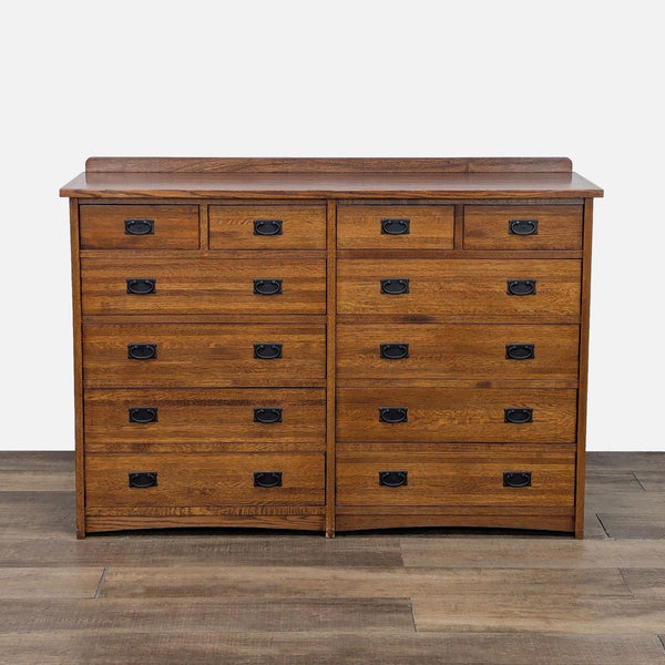 Mission-style oak dresser with 12 drawers, metal glides, and pulls.