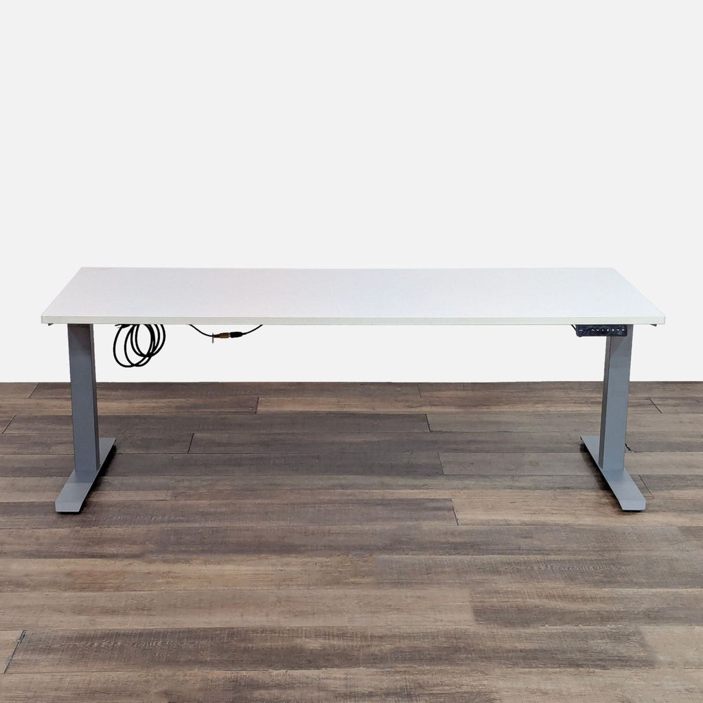 AMQ desk with laminate top and adjustable metal T legs. 