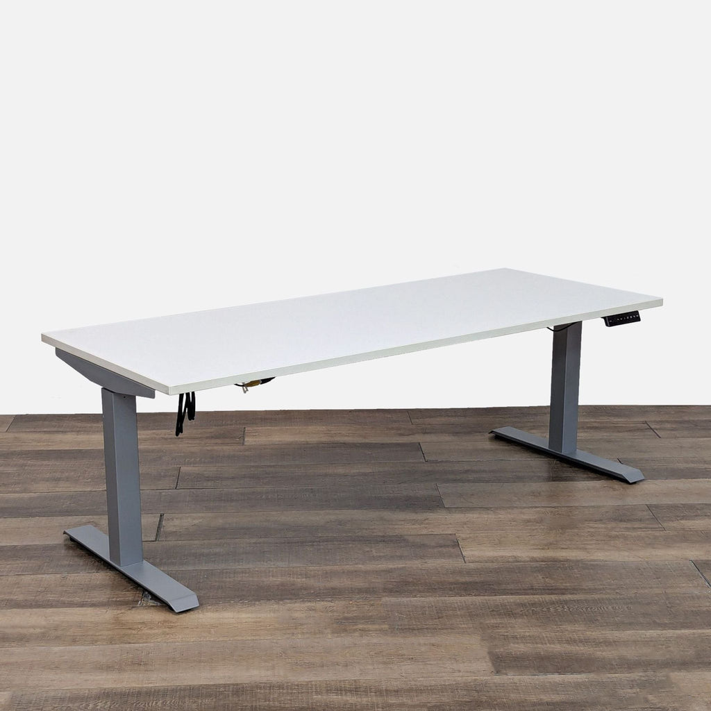 Modern AMQ desk featuring a push-button handset and 3-stage T legs.