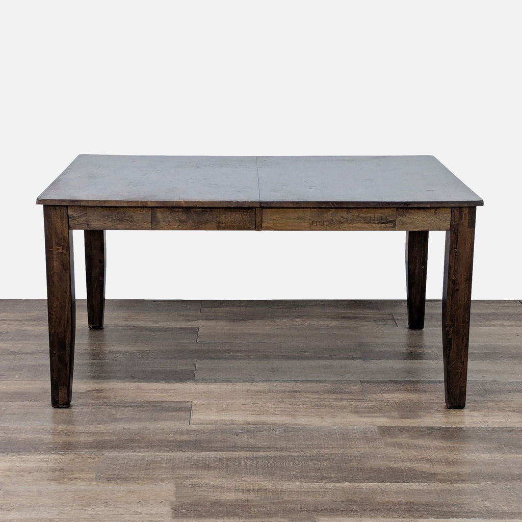 Dark wood dining table by Reperch, extension built-in, 60 inches length.