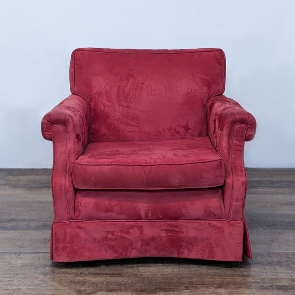 Red velvet Ethan Allen lounge chair with rolled arms and plush cushions.