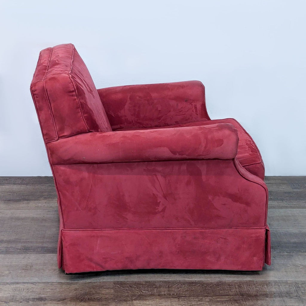 Side view of a red Ethan Allen lounge chair with elegant rolled arms.