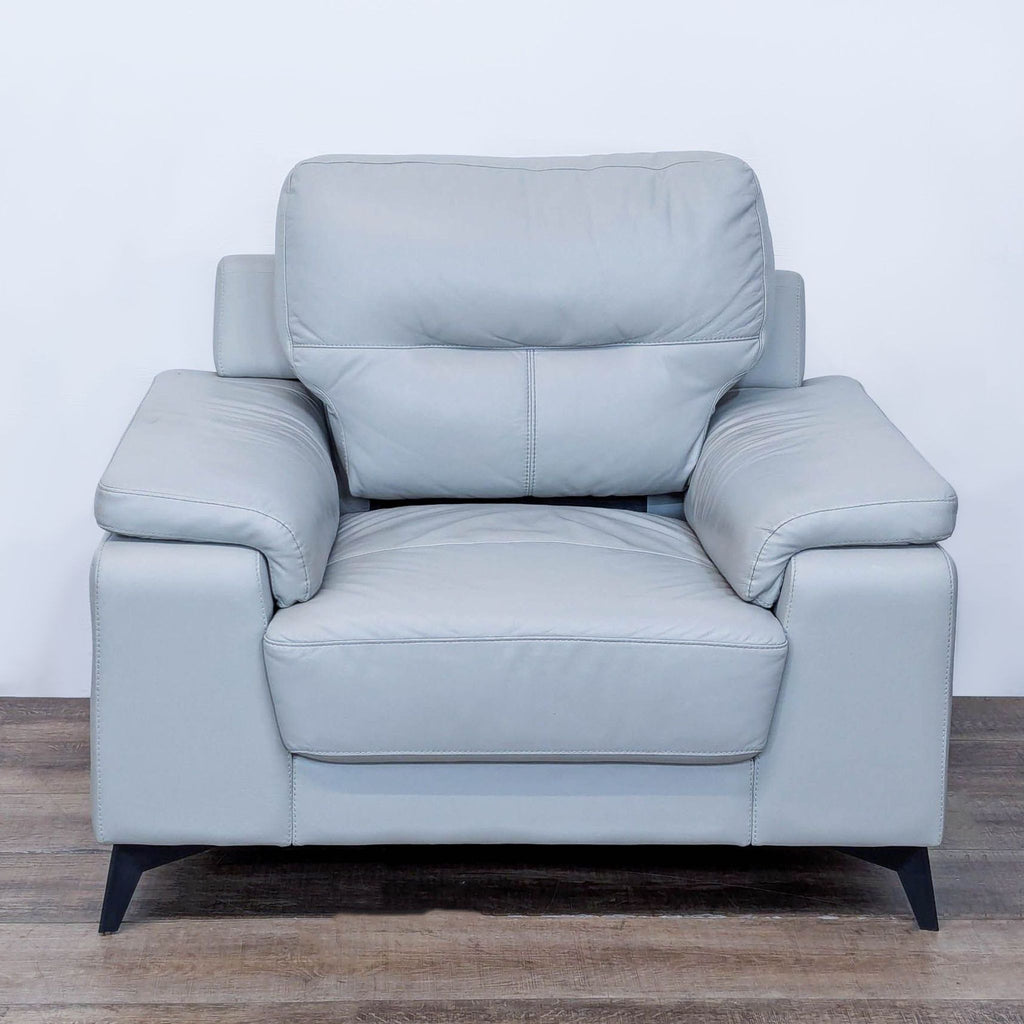 Front view of the Mischa chair with silver top grain leather and black metal legs.