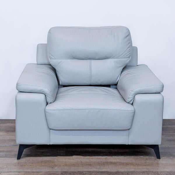 Front view of the Mischa chair with silver top grain leather and black metal legs.