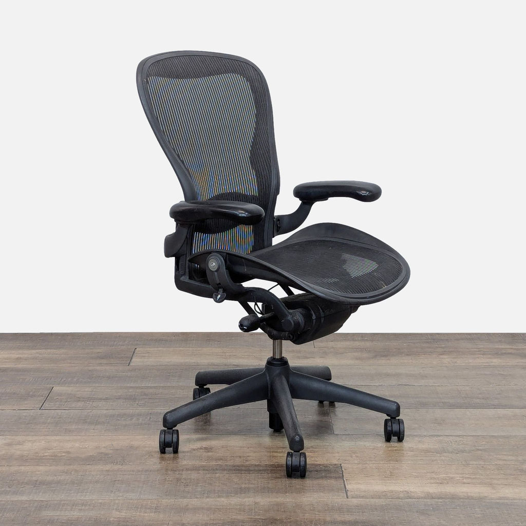 Herman Miller Aeron Chair, angled view, highlighting mesh back and seat.