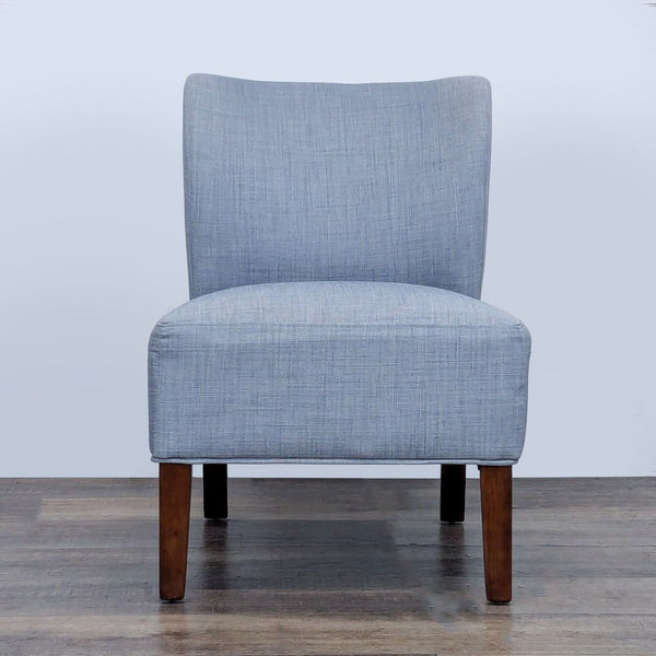 Front view of a slipper chair with wood legs and gray linen upholstery.