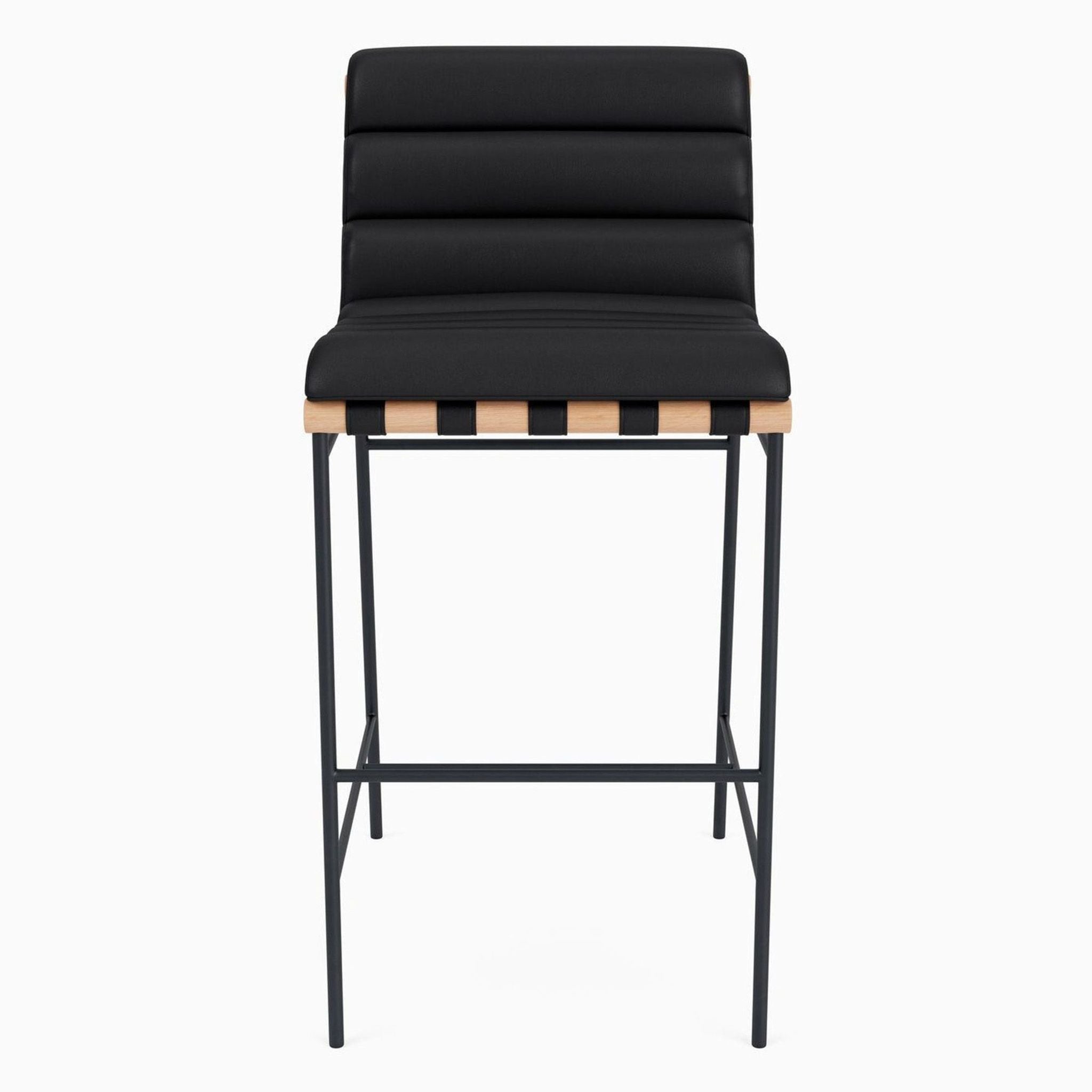 Front view of a black leather stool with oak and steel accents.