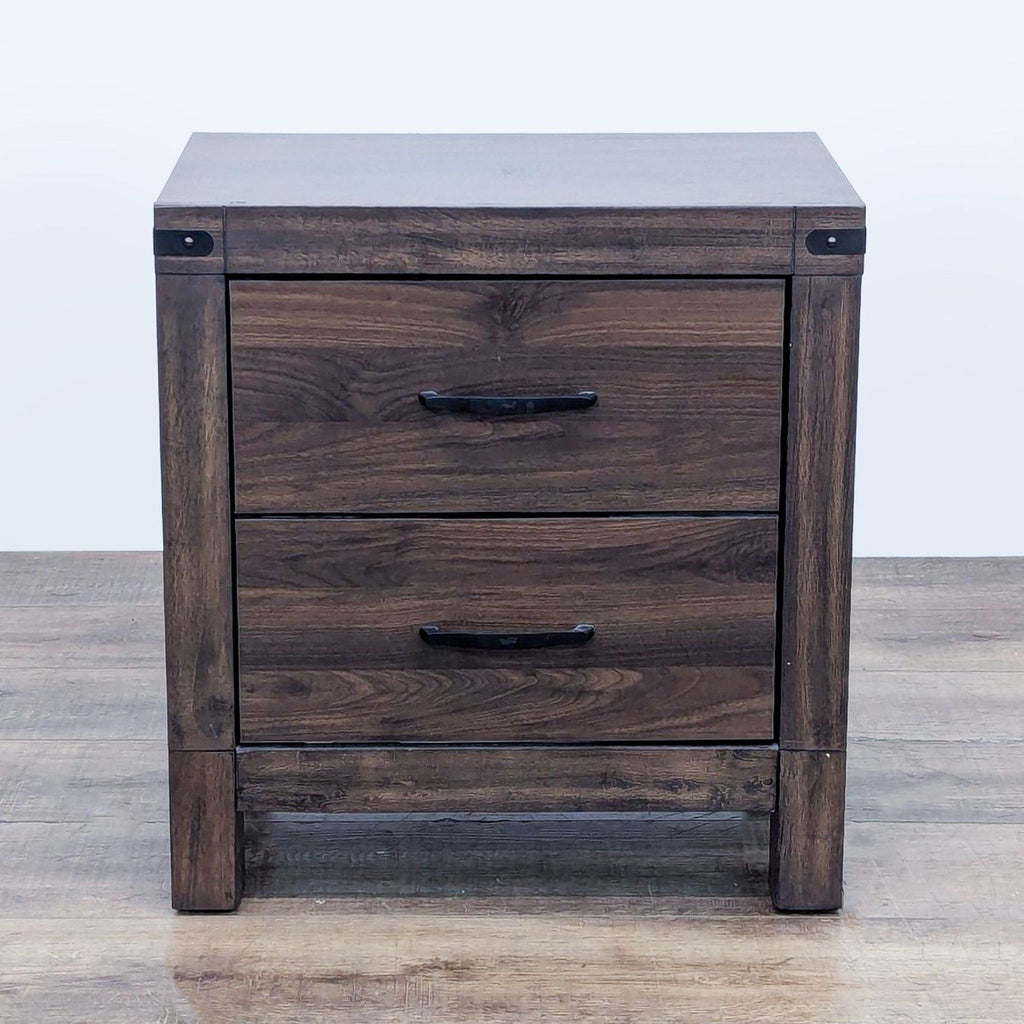 End table with two drawers, in a dark wood finish, featuring metal handles and a sturdy construction.