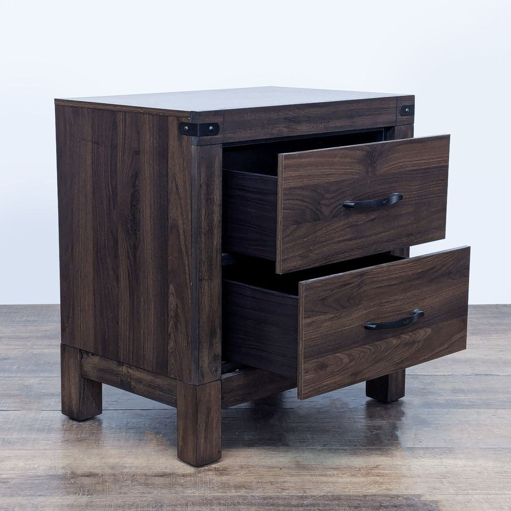 Side view of the nightstand with open drawers, showing wood texture and metal accents.