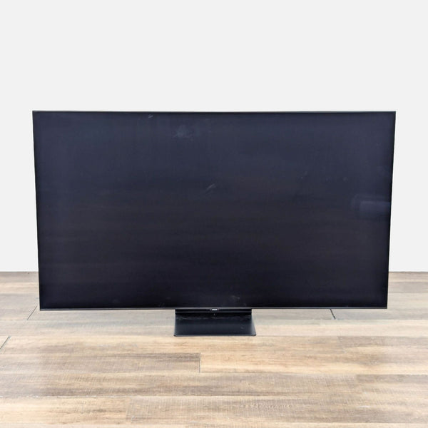 Samsung 55" UHD Smart TV with a sleek design and vibrant display.