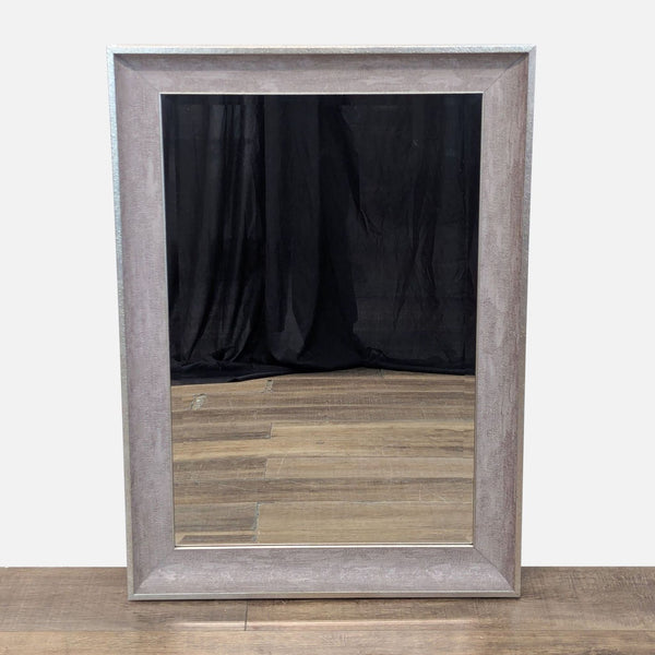 1. Rectangular mirror with a wide, rustic frame on a wooden floor background.