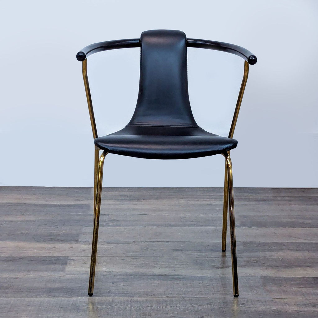 1. Modern chair with black faux leather seat and backrest, gold metal frame, front view, Reperch brand.  