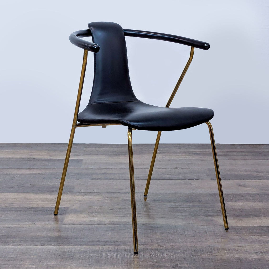 2. Sleek black faux leather and gold metal chair, side angle, curved backrest, category: Other, by Reperch.  