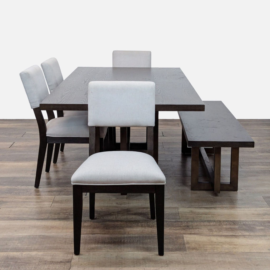 Dark wood dining set with cushioned chairs and bench by Living Spaces.