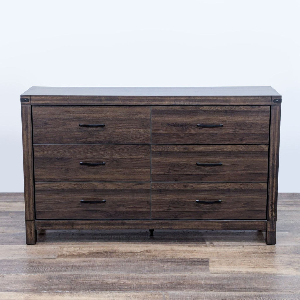 Living Spaces dresser with a solid wood finish and six drawers, shown from the front.