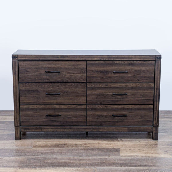 Living Spaces dresser with a solid wood finish and six drawers, shown from the front.