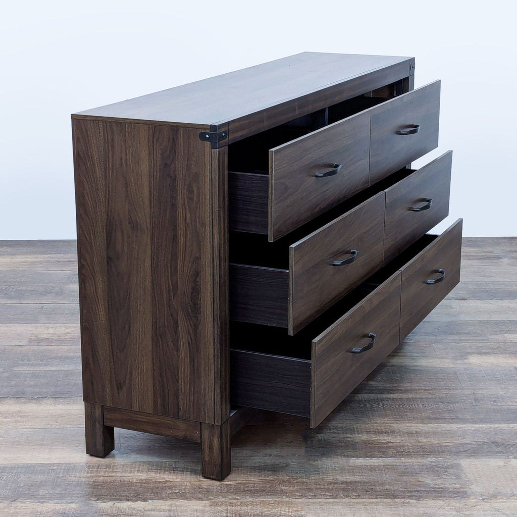 Angled view of the Living Spaces dresser, showcasing its brown finish and open drawers.