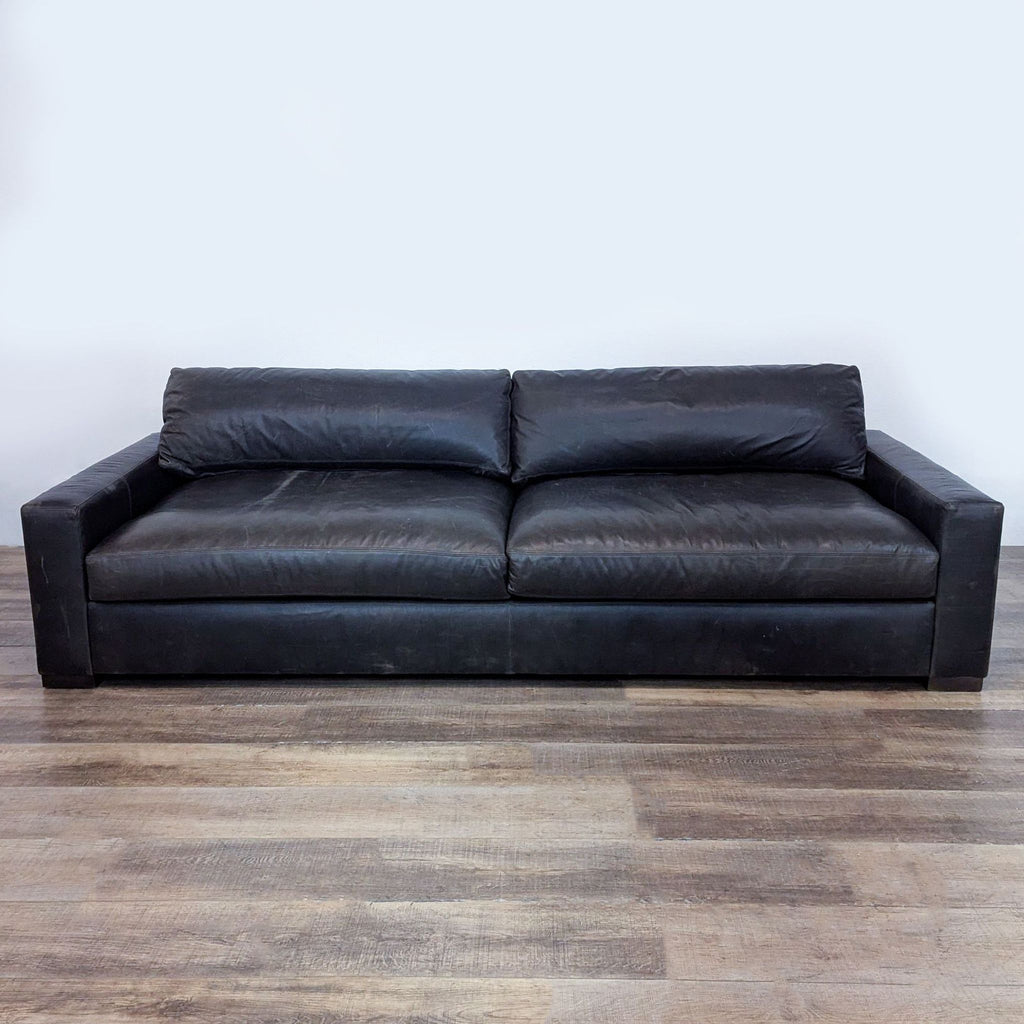 Front view of a black 3-seat leather sofa showcasing modern elegance.