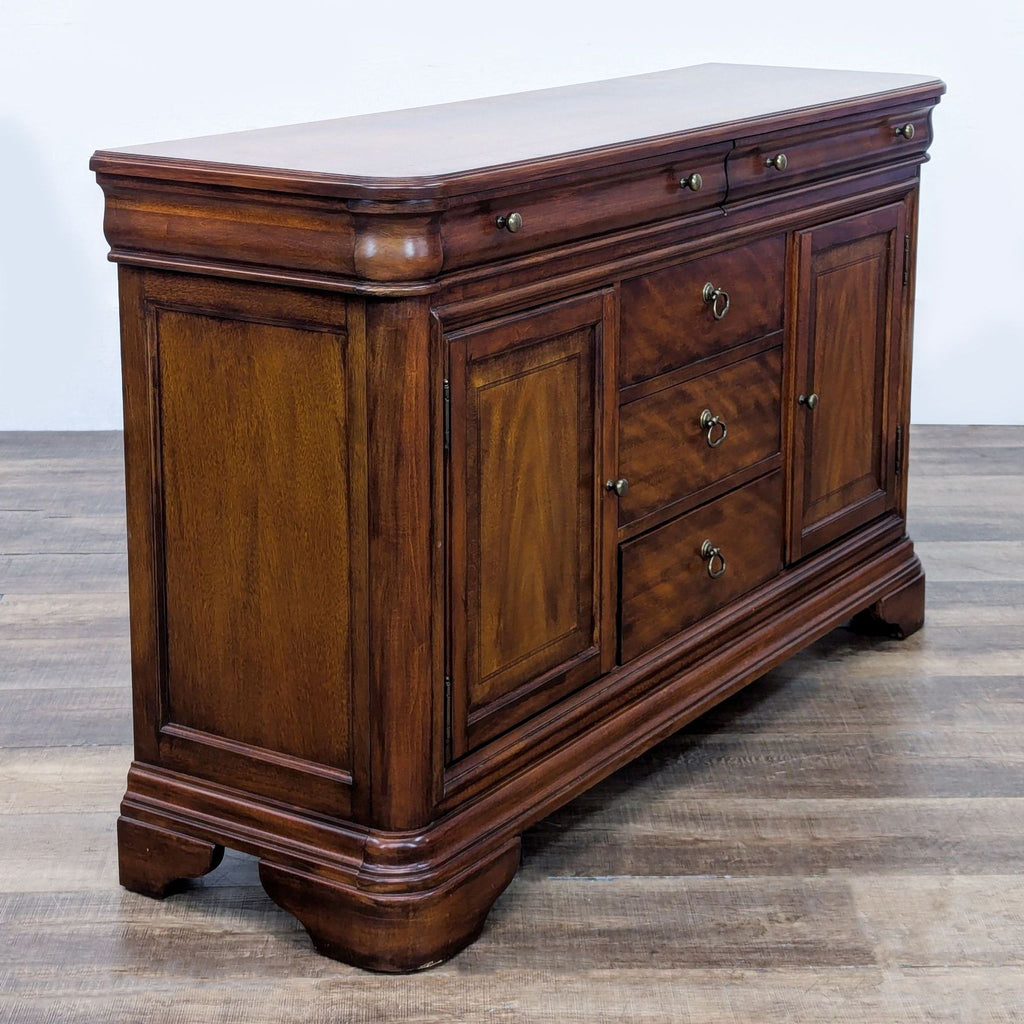 Mahogany Reperch credenza with a classic design, central drawers, and side cabinets.