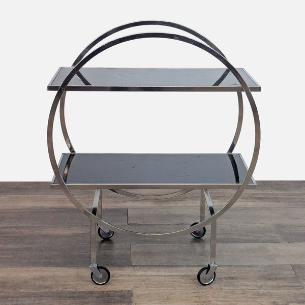 Sleek metal-framed cart with two black glass shelves and circular design.