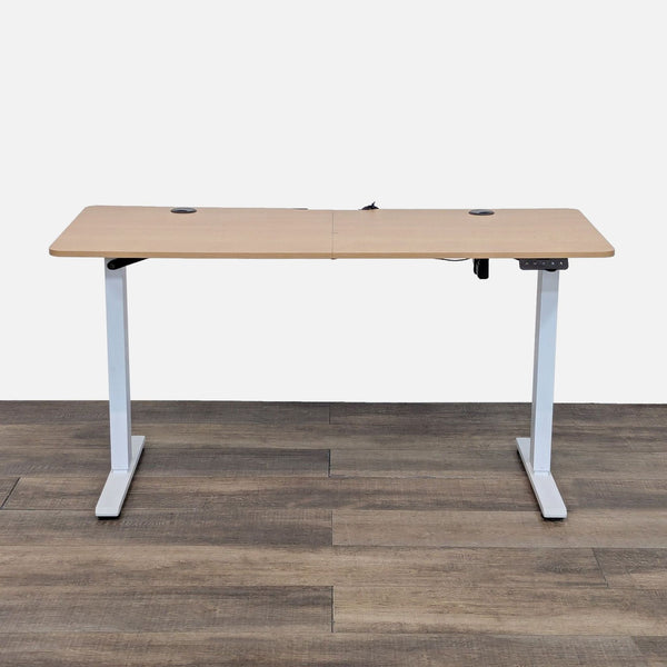 Electric desk with metal T-frame legs, oak laminate top.