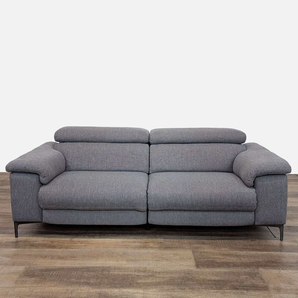 Front view of gray Talin loveseat with power recliners and headrests.